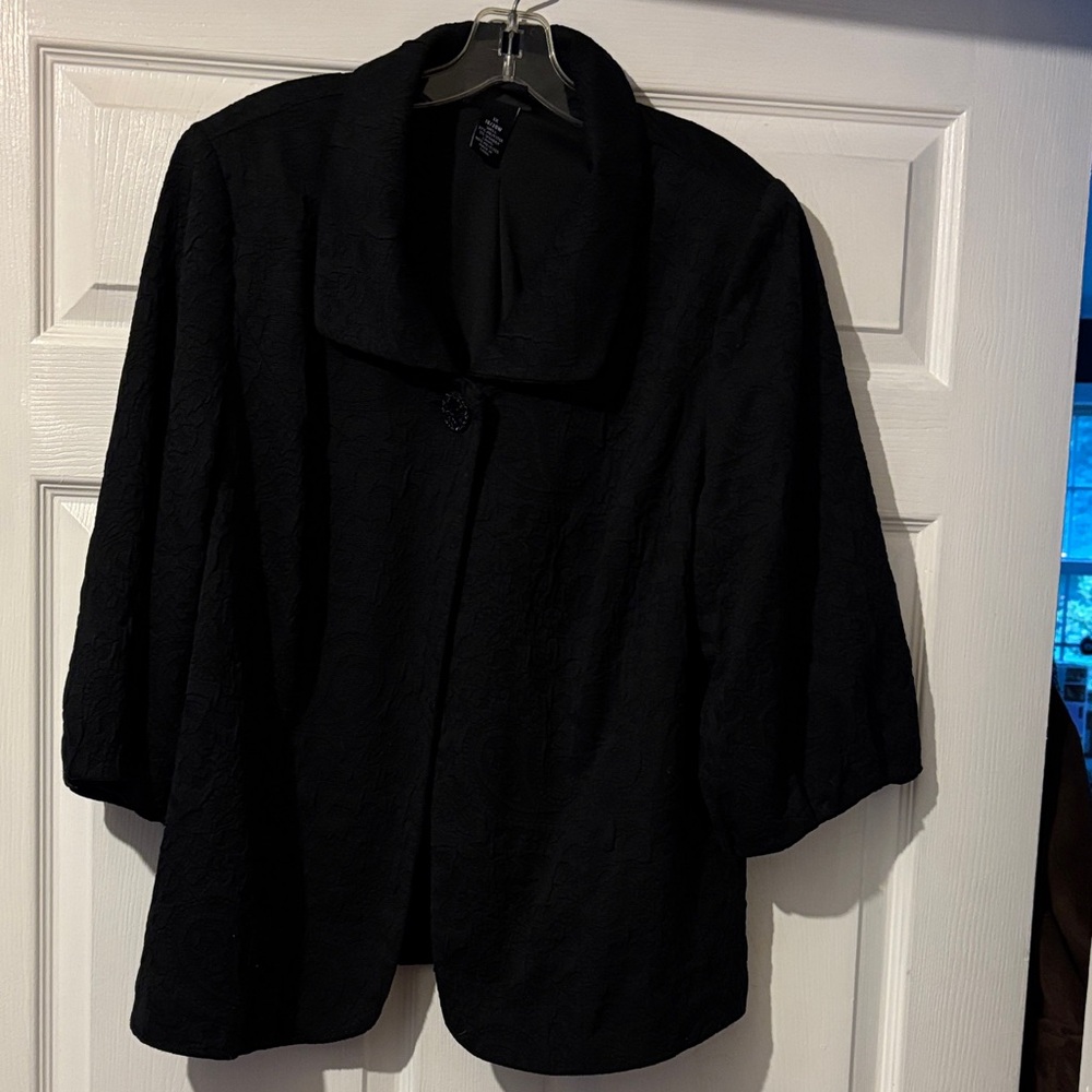 Maggie Barnes black jacket